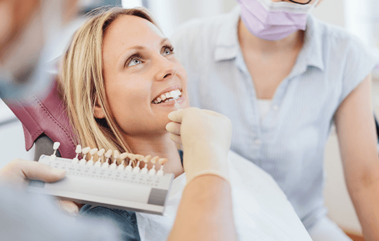 Female dental patient discussing veneers