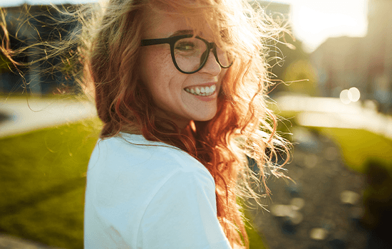 Woman smiling outdoors