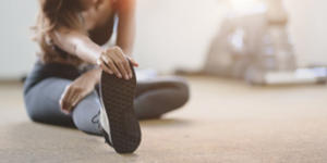 Woman stretching before starting her workout